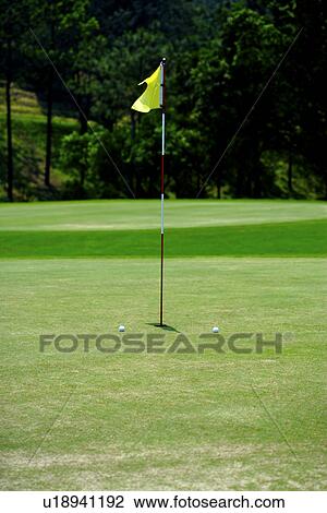 Flag on putting green View Large Photo Image Stock Image - Flag on putting green. Fotosearch