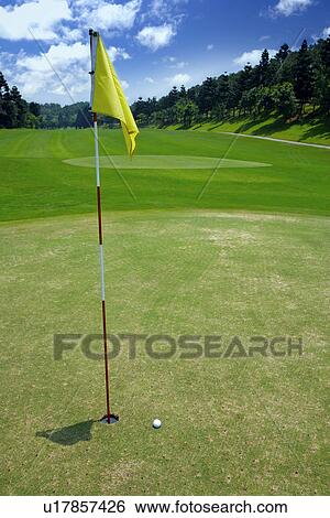 Flag on putting green View Large Photo Image Stock Photograph - Flag on putting green. Fotosearch