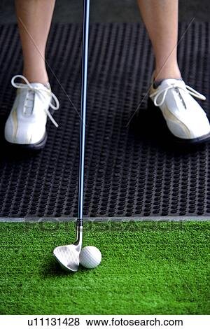 Golf ball, golf club and human legs wearing sports shoes View Large Photo Image Stock Photo - Golf ball, golf club and human legs wearing sports shoes. Fotosearch