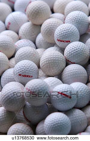 Stock Image - Golf balls, full frame. Fotosearch