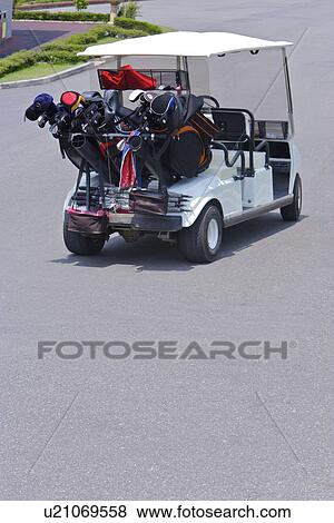 Golf cart on single road View Large Photo Image Stock Photo - Golf cart on single road. Fotosearch