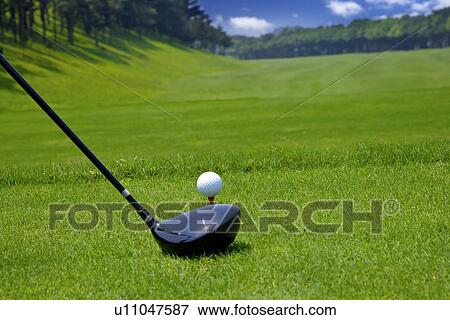 Golf club by ball on tee, close-up View Large Photo Image Stock Photo - Golf club by ball on tee, close-up. Fotosearch
