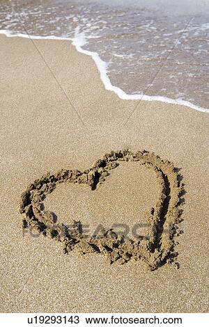 Close-up of a heart drawn in beach View Large Photo Image Stock Image - Close-up of a heart drawn in beach. Fotosearch