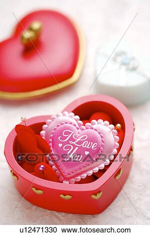 Stock Image - Heart shape in gift box. Fotosearch