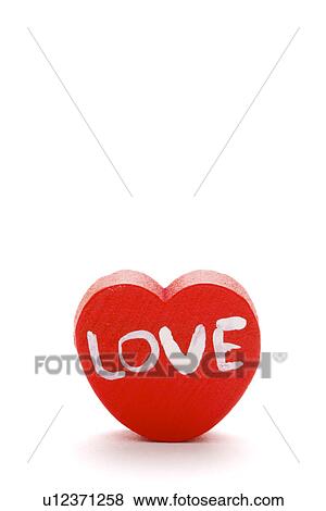 "LOVE" word written on heart shaped object View Large Photo Image Stock Photo - "LOVE" word written on heart shaped object. Fotosearch