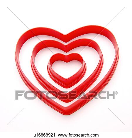 Three different-sized heart shaped objects View Large Photo Image Stock Image - Three different-sized heart shaped objects. Fotosearch