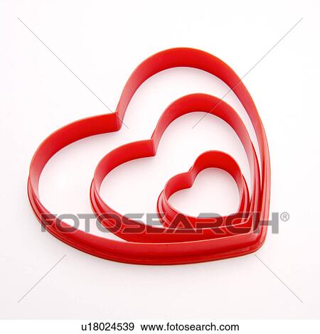 Three different-sized plastic object with heart shape View Large Photo Image Stock Photo - Three different-sized plastic object with heart shape. Fotosearch