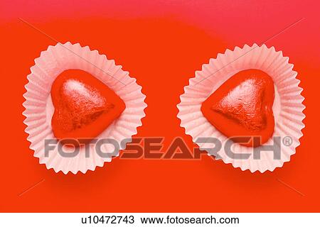 Stock Image - Two heart shaped candies. Fotosearch