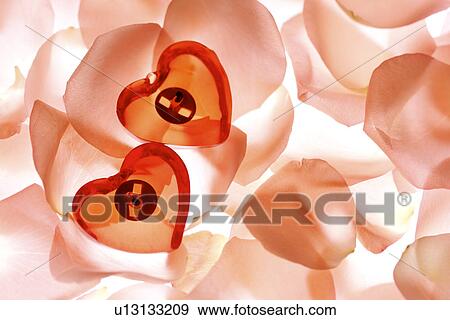 Two heart shaped pendants View Large Photo Image Stock Photo - Two heart shaped pendants. Fotosearch