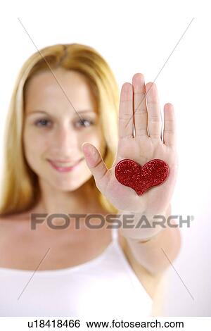Young woman showing heart shape View Large Photo Image Stock Photograph - Young woman showing heart shape. Fotosearch