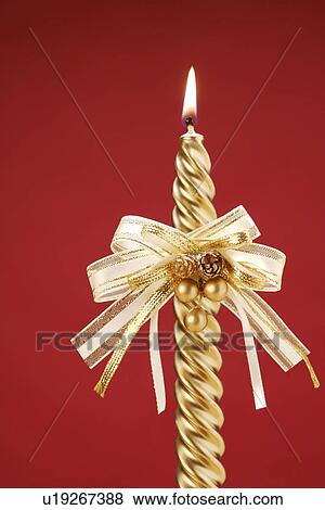 Stock Photo - Candle with bow. Fotosearch