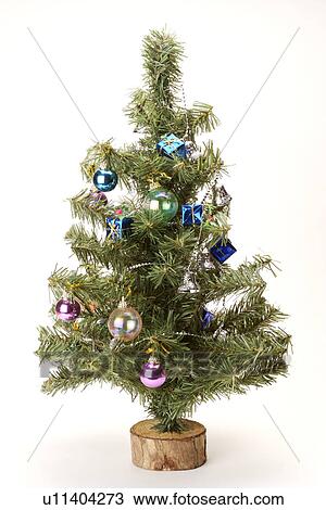 Stock Image - Christmas decorations on tree, close-up. Fotosearch