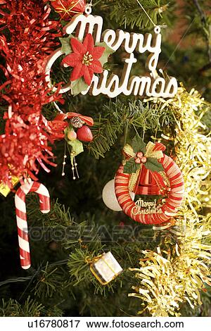 Christmas decorations on tree, close-up View Large Photo Image Stock Photo - Christmas decorations on tree, close-up. Fotosearch