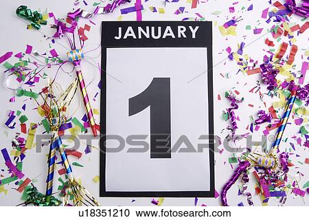 Confetti and horn blower on calendar showing New Year's Day, close-up View Large Photo Image Stock Image - Confetti and horn blower on calendar showing New Year's Day, close-up. Fotosearch
