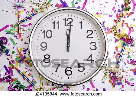 Picture - Confetti, Party Horn Blower and Clock. Fotosearch