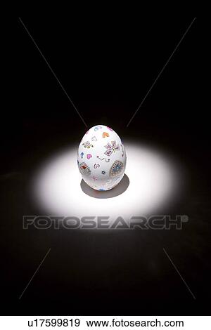Stock Photo - Easter egg glowing in the black background. Fotosearch