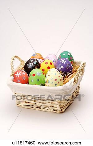 Stock Image - Easter eggs in basket. Fotosearch