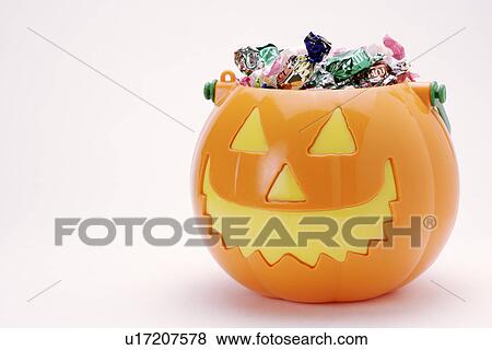 Pumpkin full of candies View Large Photo Image Stock Photo - Pumpkin full of candies. Fotosearch