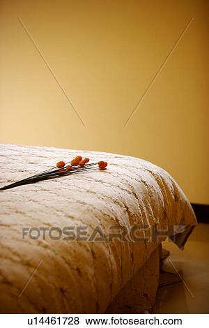 Artificial flowers on bed View Large Photo Image Stock Photo - Artificial flowers on bed. Fotosearch