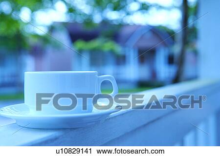 Stock Image - Coffee cup on baluster. Fotosearch
