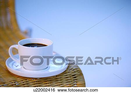 Coffee cup on bamboo chair View Large Photo Image Stock Photograph - Coffee cup on bamboo chair. Fotosearch
