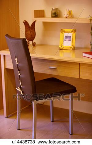 Stock Photo - Desk and chair in room. Fotosearch