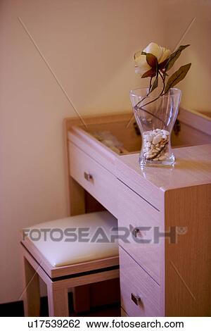 Stock Image - Desk with vase and chair. Fotosearch