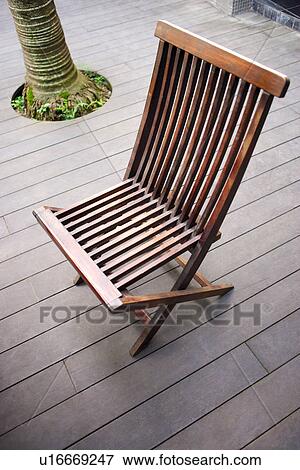 Folding chair outdoors View Large Photo Image Stock Photo - Folding chair outdoors. Fotosearch