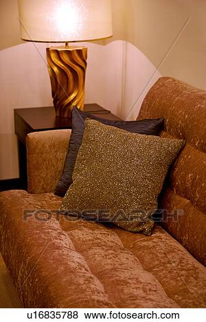 Illuminated lamp by sofa View Large Photo Image Stock Photo - Illuminated lamp by sofa. Fotosearch