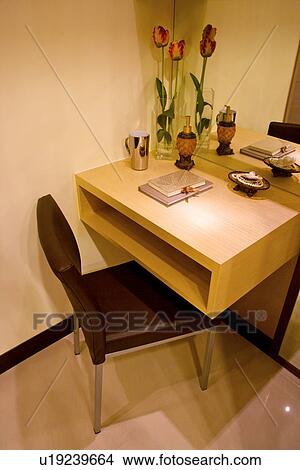Picture - Side table and chair. Fotosearch