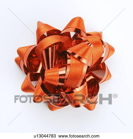 Stock Image - Flower shaped red ribbon, close-up. Fotosearch