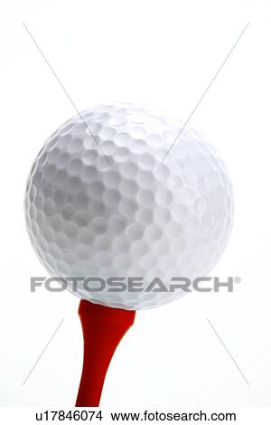 Picture - Golf ball on tee, close up. Fotosearch