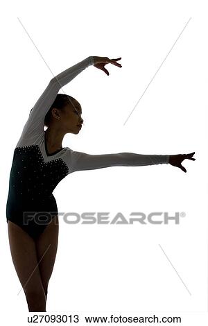Girl practicing gymnastic pose on pad, silhouette View Large Photo Image Stock Image - Girl practicing gymnastic pose on pad, silhouette. Fotosearch