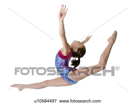 Girl practicing gymnastic pose, side view View Large Photo Image Stock Photo - Girl practicing gymnastic pose, side view. Fotosearch