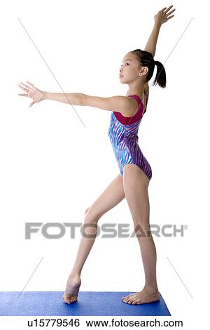 Girl practicing gymnastic pose, side view View Large Photo Image Stock Photograph - Girl practicing gymnastic pose, side view. Fotosearch