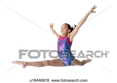 Girl practicing gymnastic pose View Large Photo Image Stock Photo - Girl practicing gymnastic pose. Fotosearch