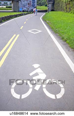 Bicycle lane signage on street View Large Photo Image Picture - Bicycle lane signage on street. Fotosearch