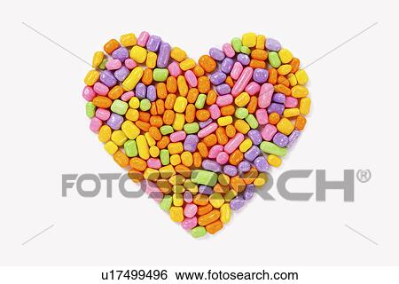 Stock Photograph - Candies in heart shape. Fotosearch