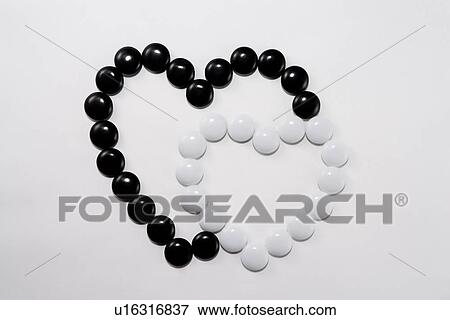 Stock Photo - Go pieces form two hearts. Fotosearch