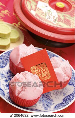 Stock Image - Chinese muffins with red envelope. Fotosearch