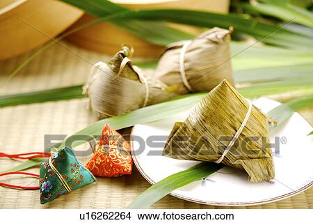 Picture - Chinese rice dumplings, two dumplings wrapped with satin. Fotosearch