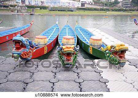 Dragon boats moored at waterside View Large Photo Image Picture - Dragon boats moored at waterside. Fotosearch