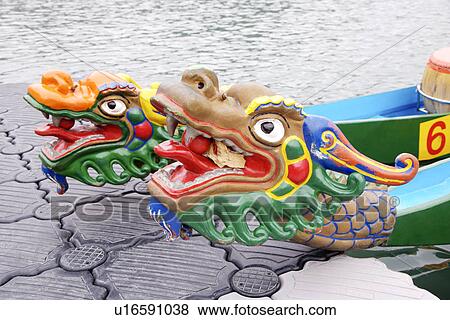 Dragon boats moored at waterside View Large Photo Image Stock Photo - Dragon boats moored at waterside. Fotosearch