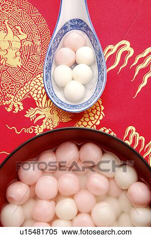 Stock Photography - Dumplings in spoon and a bowl of dumplings. Fotosearch