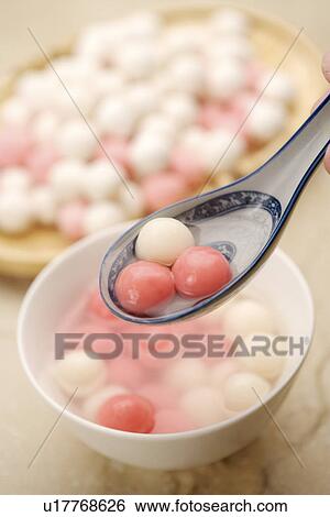Dumplings in spoon, dumplings made of sweet rice, rolled into balls and stuffed with either sweet View Large Photo Image Stock Photograph - Dumplings in spoon, dumplings made of sweet rice, rolled into balls and stuffed with either sweet. Fotosearch