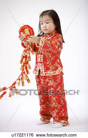 Girl holding firecrackers View Large Photo Image Stock Photograph - Girl holding firecrackers. Fotosearch