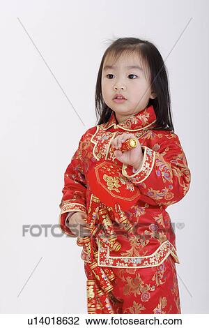 Girl in traditional clothing holding firecrackers View Large Photo Image Stock Image - Girl in traditional clothing holding firecrackers. Fotosearch