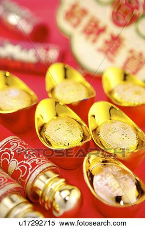 Gold ingots and rolled chinese couplets View Large Photo Image Stock Photography - Gold ingots and rolled chinese couplets. Fotosearch