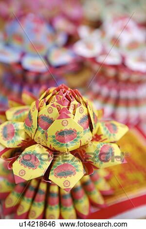 Stock Photograph - Lotus Platform made of papers. Fotosearch