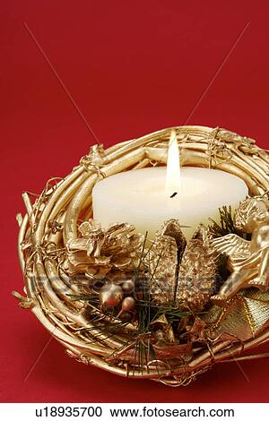 Stock Image - Christmas candles and pinecones. Fotosearch
